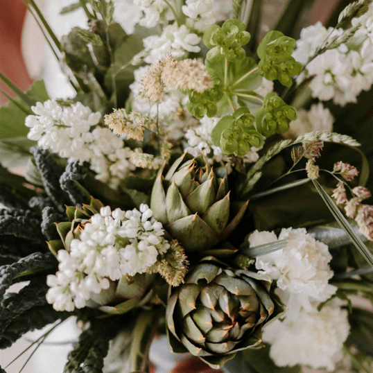 artichoke in the bride's bouquet.Artichoke and cabbage wedding bouquet.Unique green and natur bride's bouquet with artichoke and white carnations delivery in Genova.Wedding bouquet on Italian and French Riviera.Flower delivery in Genova,liguria,Portofino
