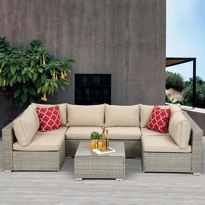 7 piece rattan sectional seating group with cushions