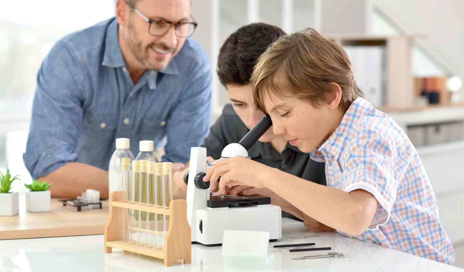 Kids using microscope