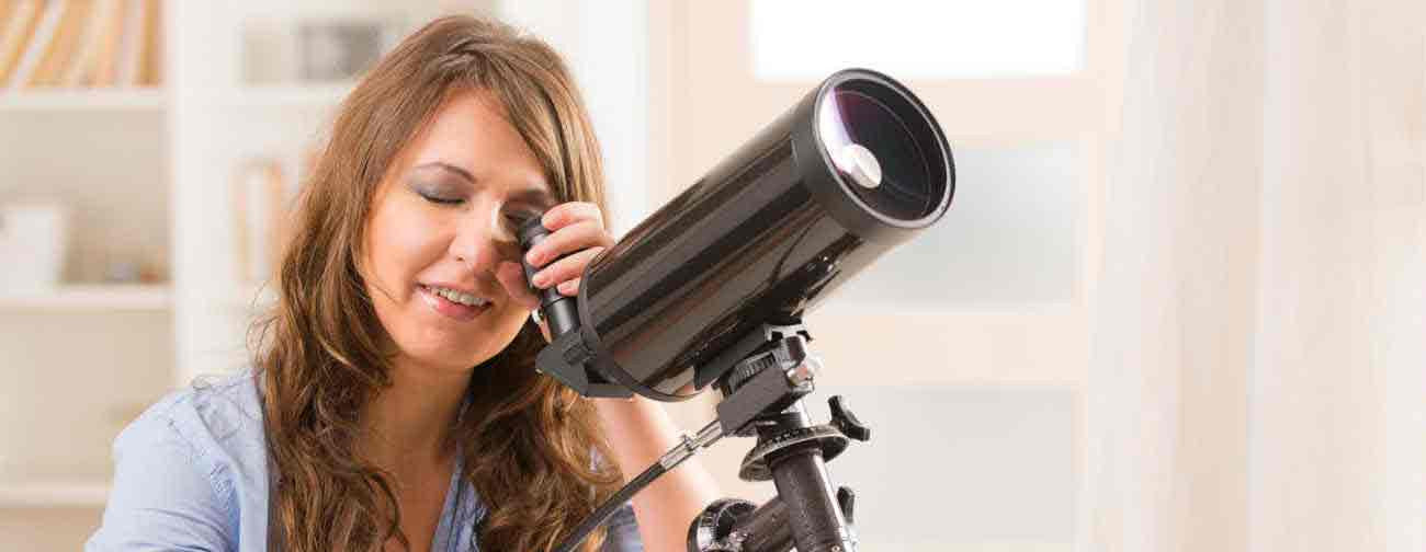 Woman using telescope