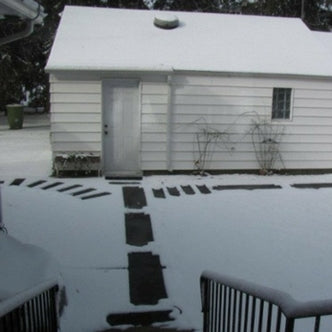 Brent easily gets from his house to his garage in the snow