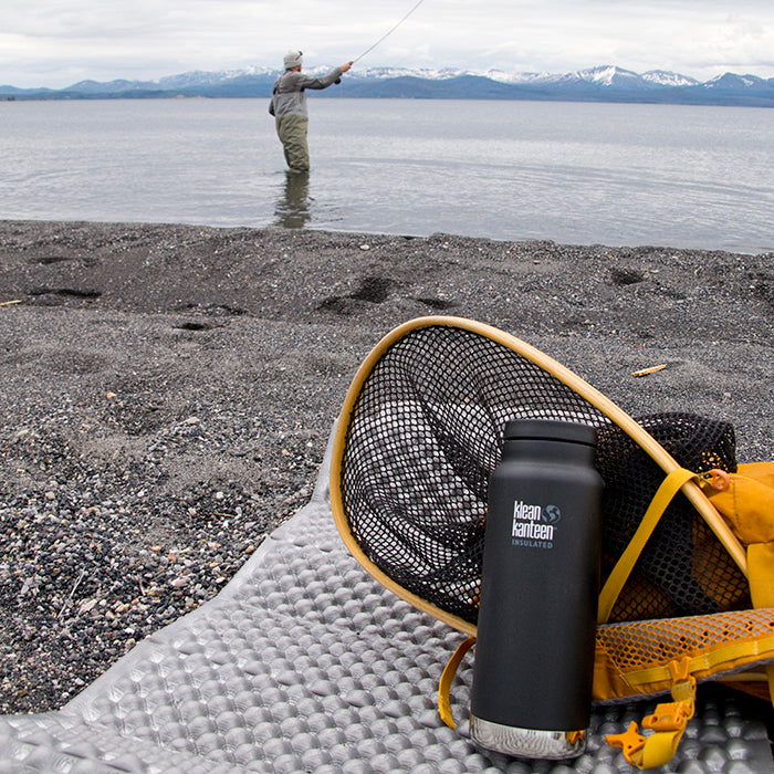 Klean Ambassador Sean Jansen fishing in Yellowstone Lake with Klean Kanteen