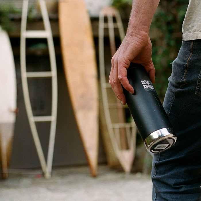 Nole Cossart builds 1930s wooden surfboards, with Klean by his side