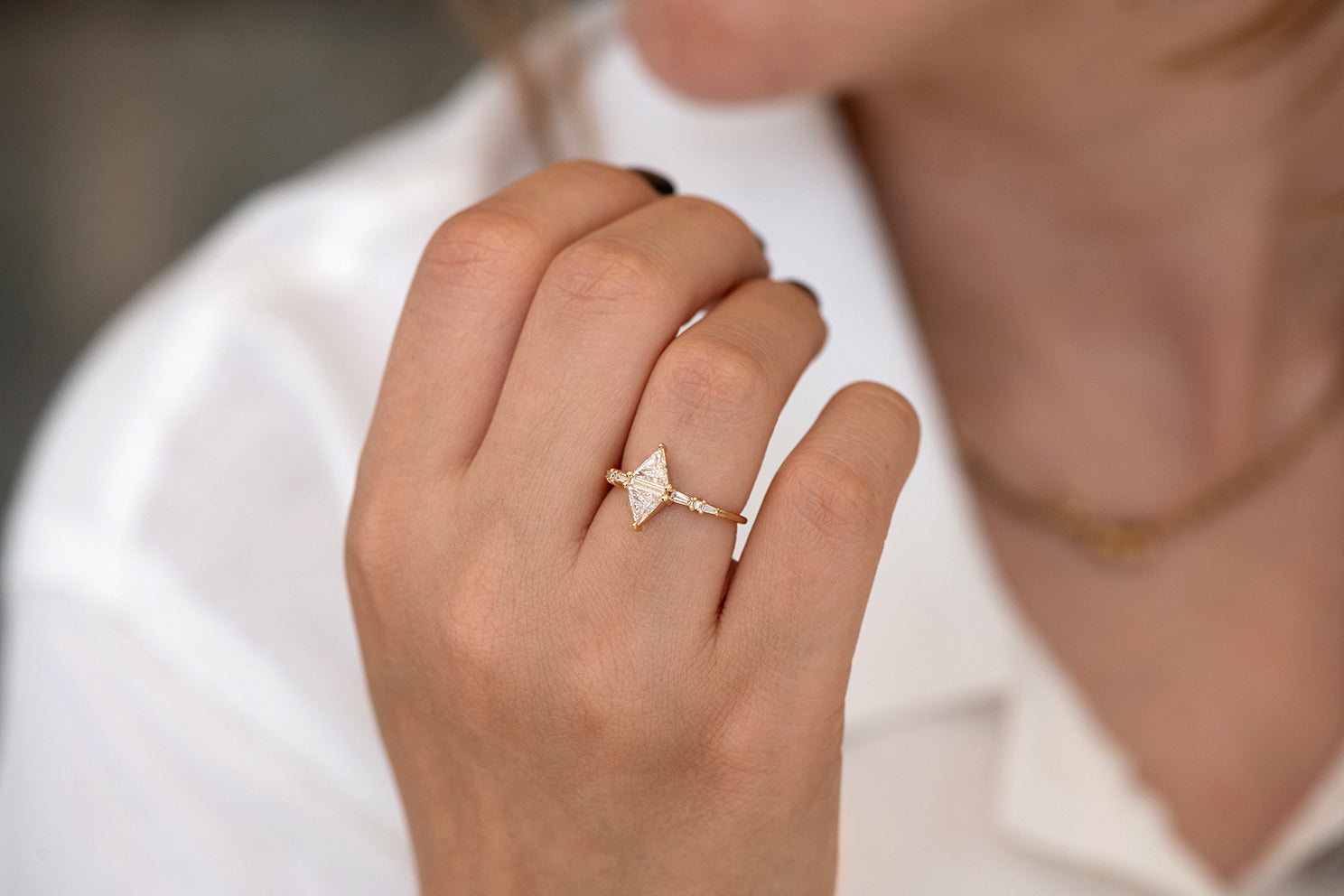 Geometric Engagement Ring with Triangle and Baguette Diamonds on Hand side angle