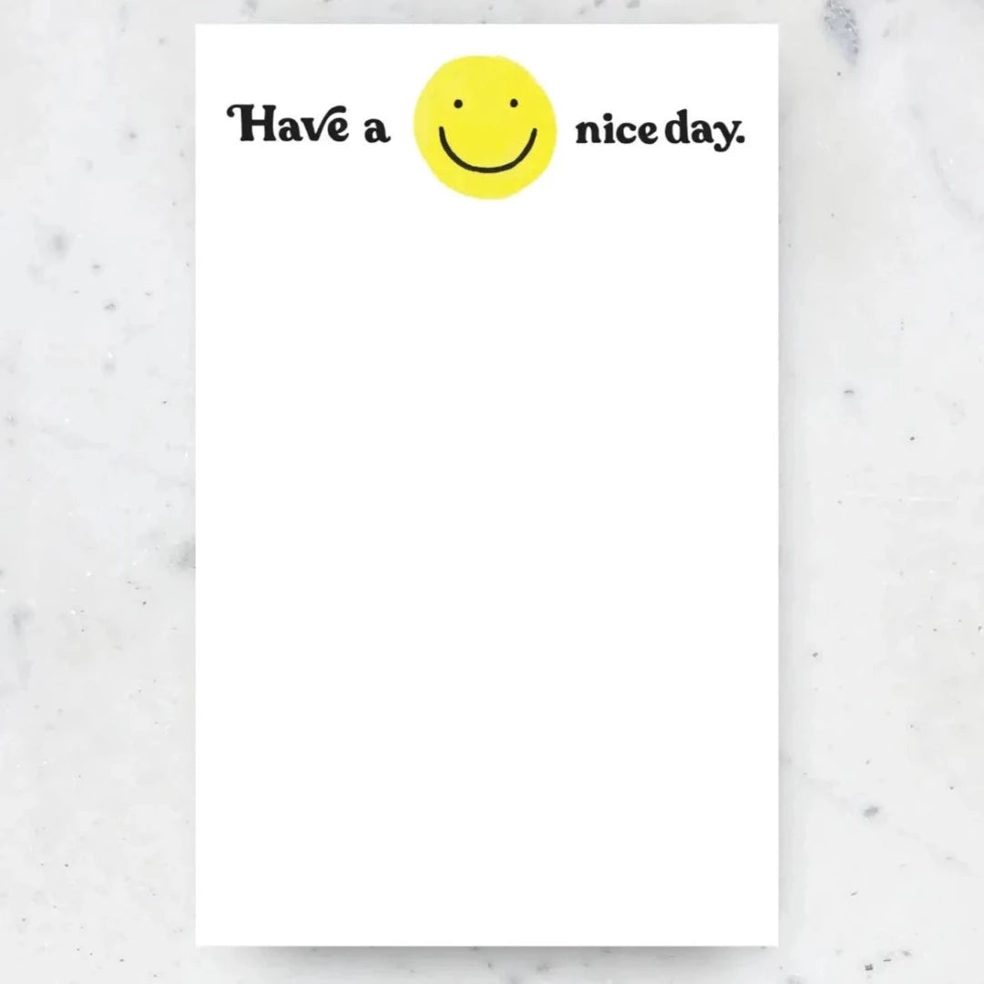 long white notepad that says have a nice day with a yellow smiley face