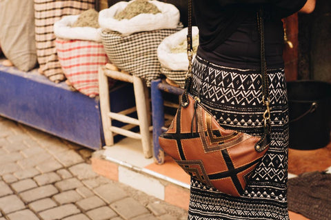 Girl standing next to Moroccan spices