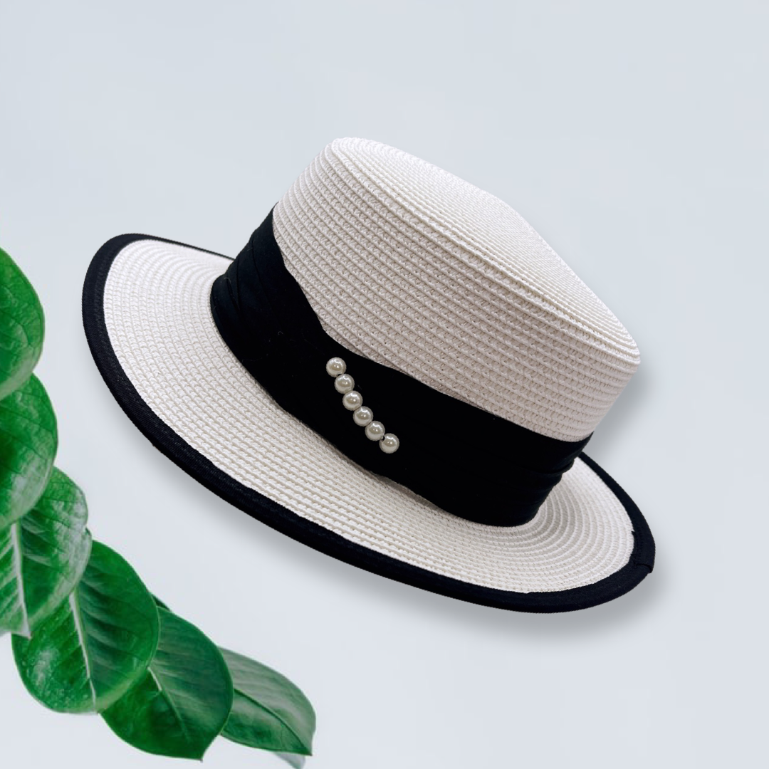 white sun hat with black ribbon