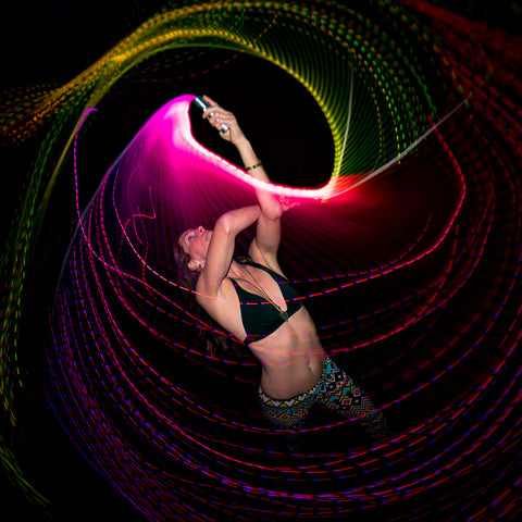Pixelwhipping dancer with two FiberFlies light up whips