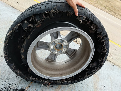Damaged tire on our roadtrip after the festival