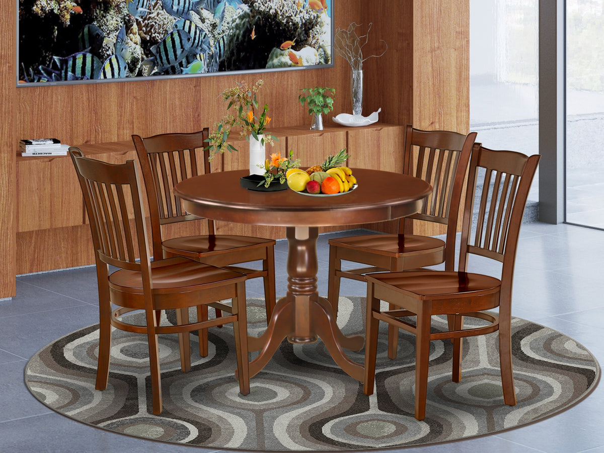 round table with fitted chairs