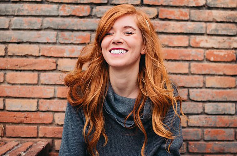 This Ancient Grain Could Seriously Strengthen Your Hair Article Image Of Girl With Long Red Hair Smiling At The Camera