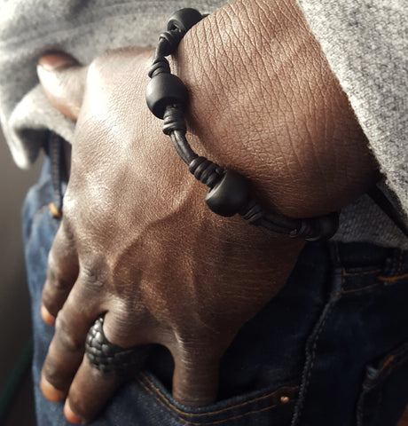 Chuma African Trade Bead Bracelet and Kama Braided Leather Ring on male model