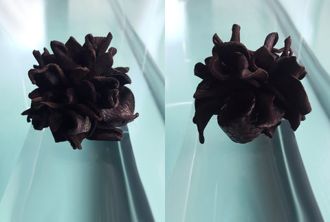 a single leather flower on a braided leather ring by lisa cantalupo