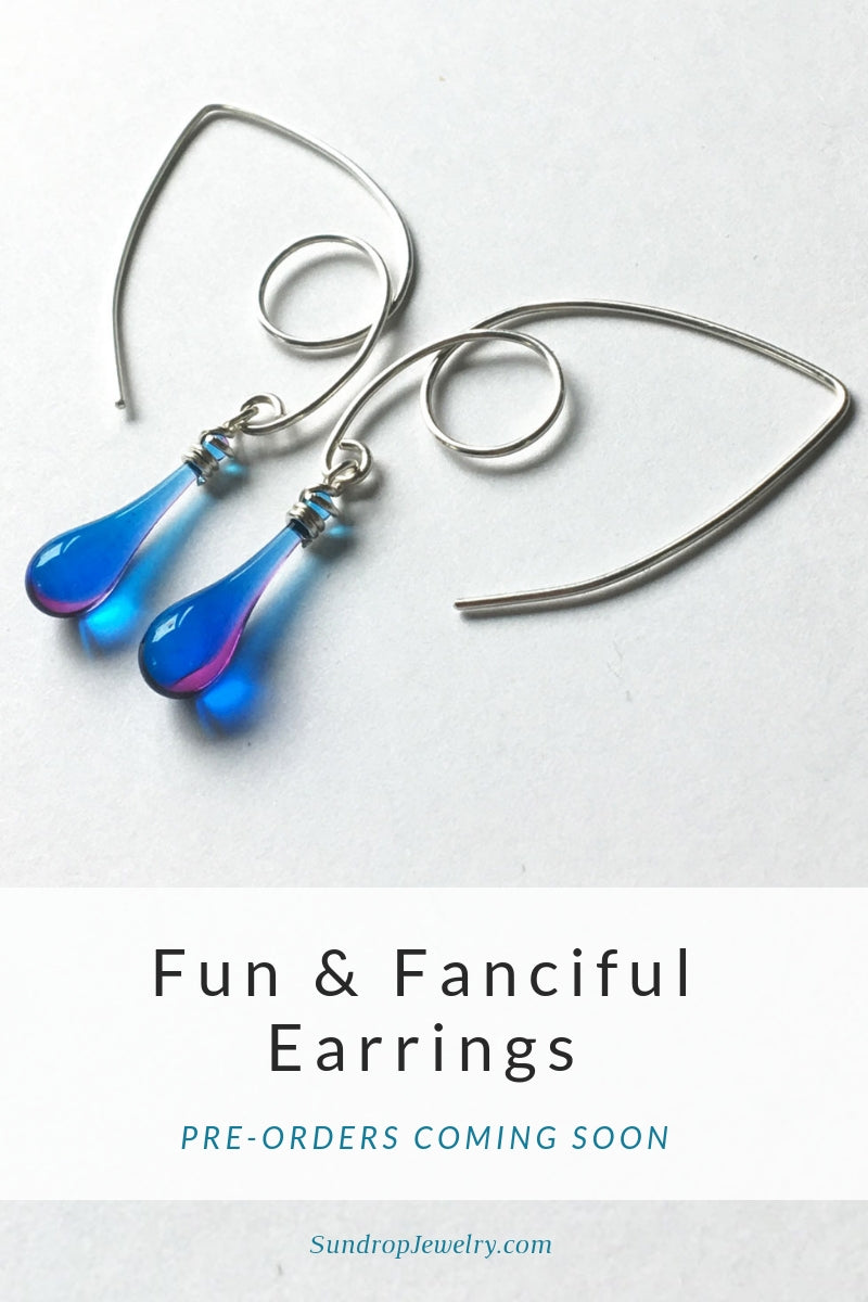 Fun and fanciful silver marquise earrings with sun-melted glass drop dangles