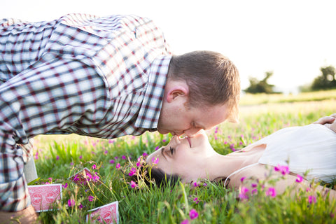 photo of man and woman in grass