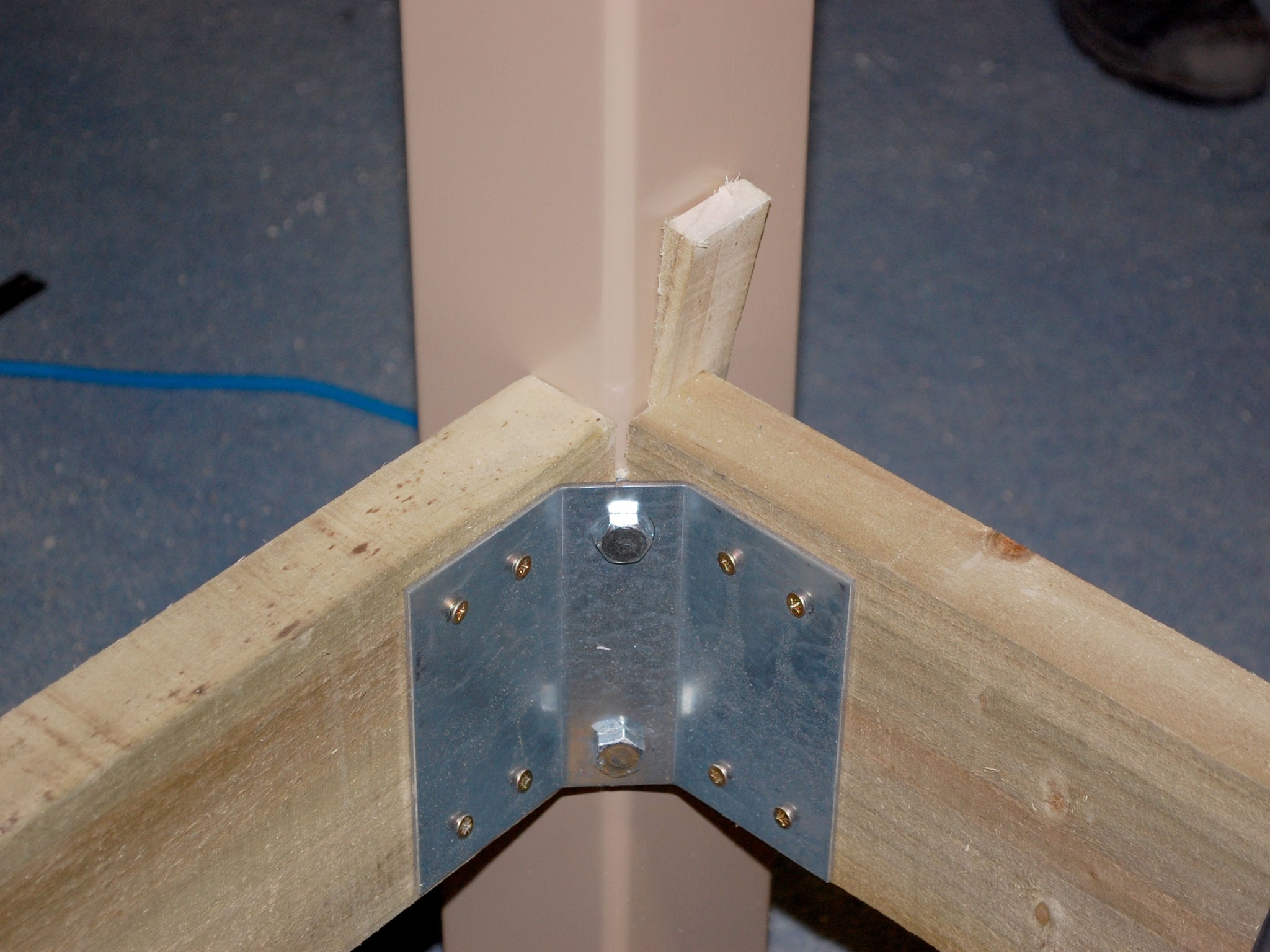 deck frame metal bracket with post attached