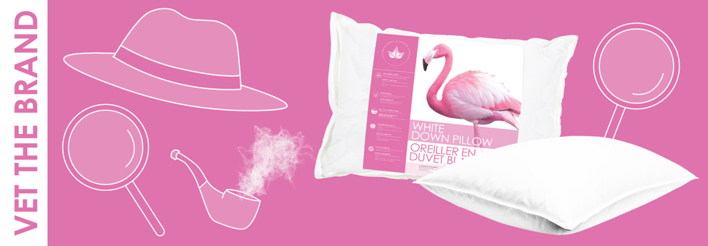 detective hat, magnifying glass and pipe with pillows on pink background