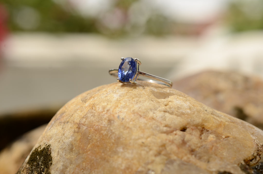 blue sapphire ring on rock 