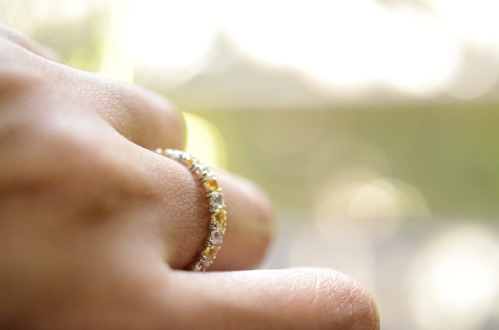 yellow and white sapphire eternity ring