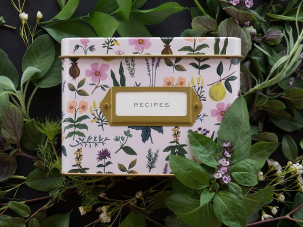 Lilac Rifle Paper Co recipe tea featuring illustrations of herbs and flowers sitting amongst greenery