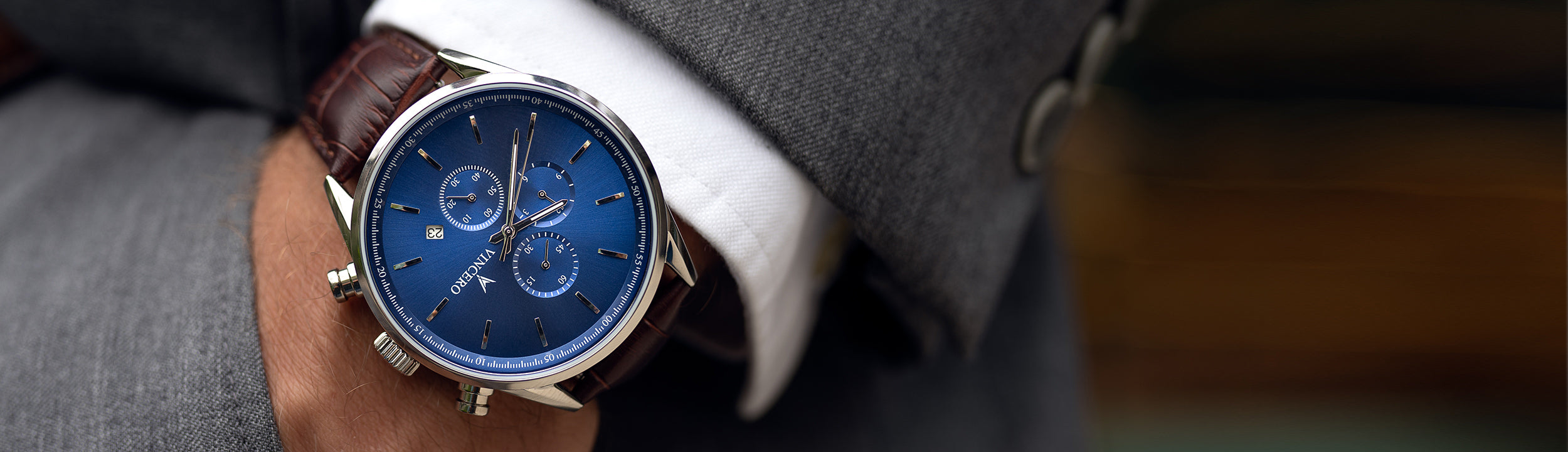Close up hand in pocket with blue and silver watch