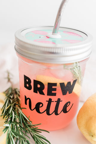 Rosemary pink lemonade in a reusable mason jar tumbler