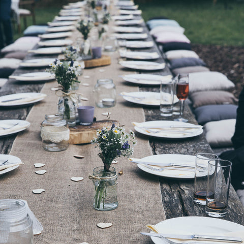 Long table wedding decor with mason jars and fresh flowers