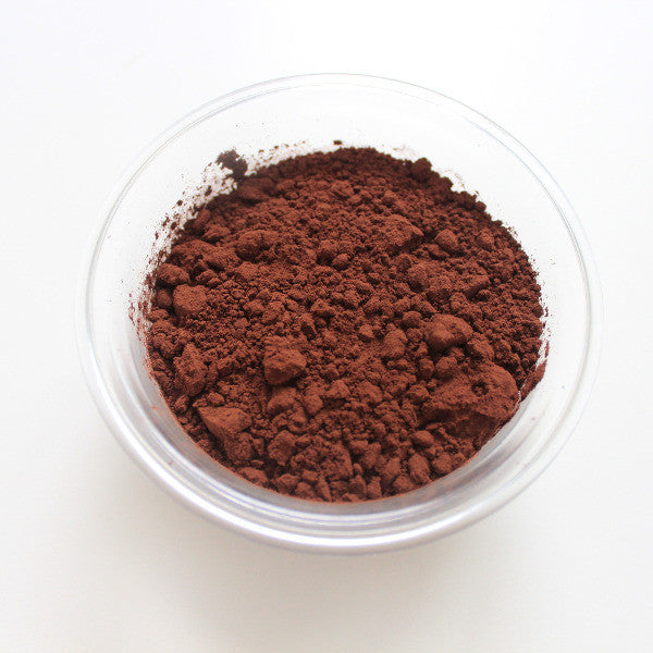 image of a clear bowl of cocoa powder