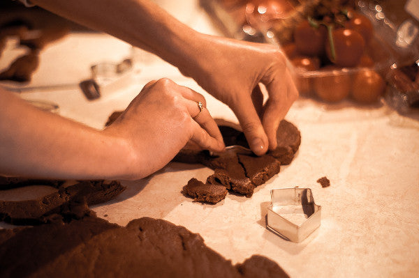 Woman making home made gingerbread cookies while using arrowroot powder