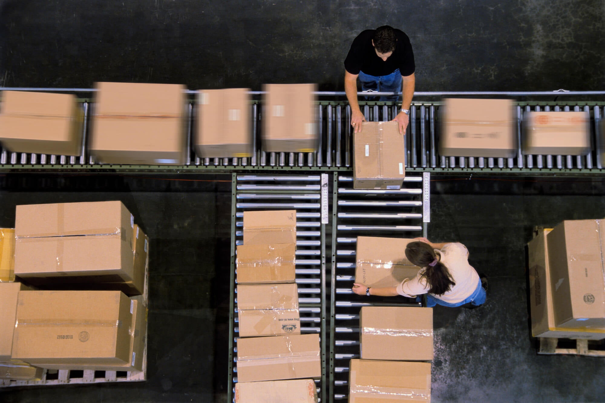 Packages moving in warehouse conveyor belt