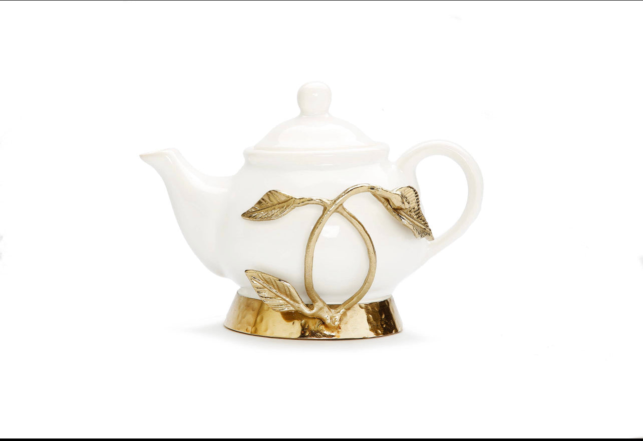 gold and white tea kettle