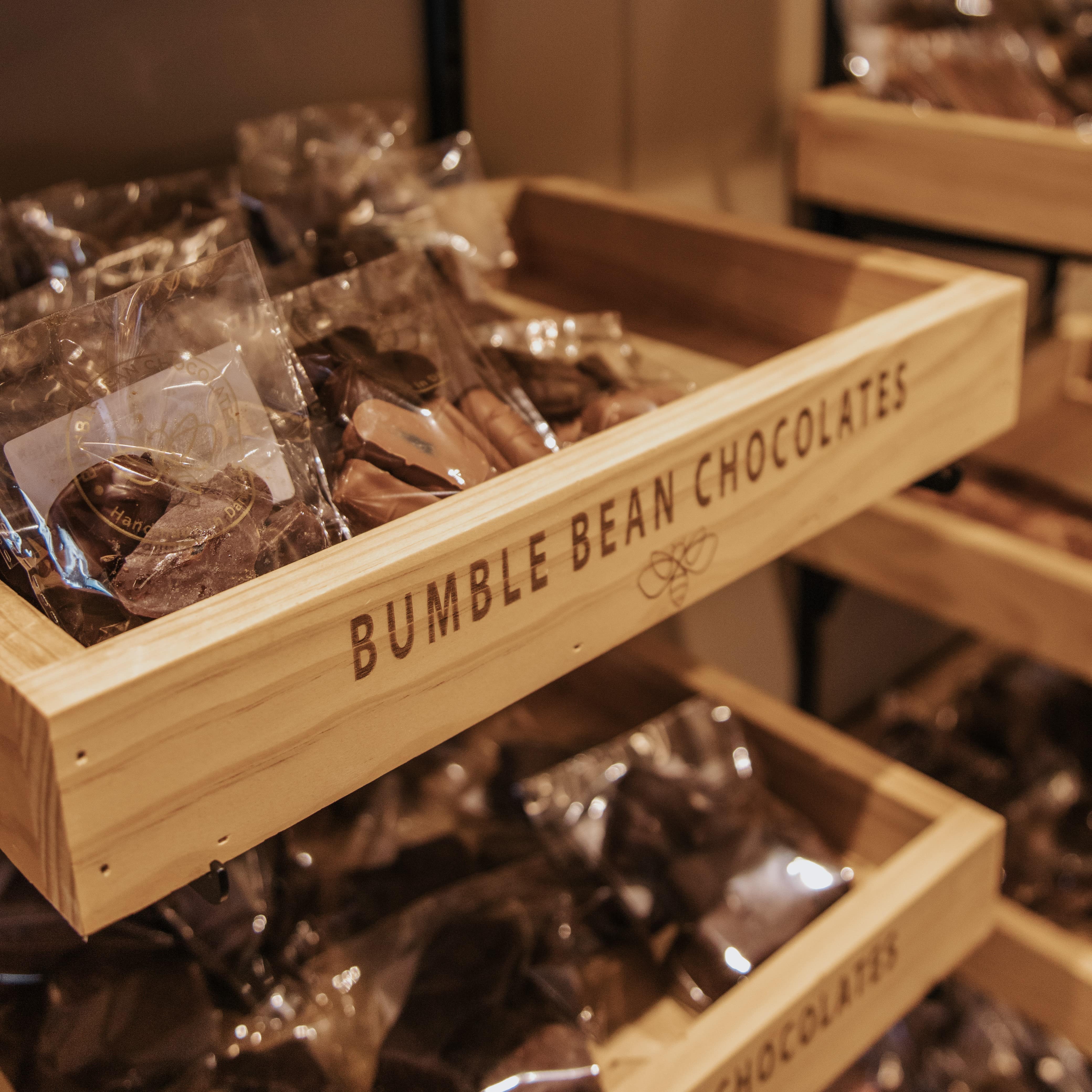 a wooden box filled with lots of brumble bean chocolates