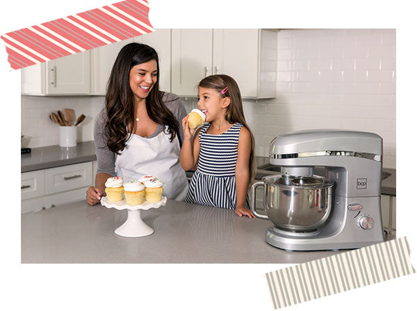 Mom and daughter baking cupcakes with stand mixer