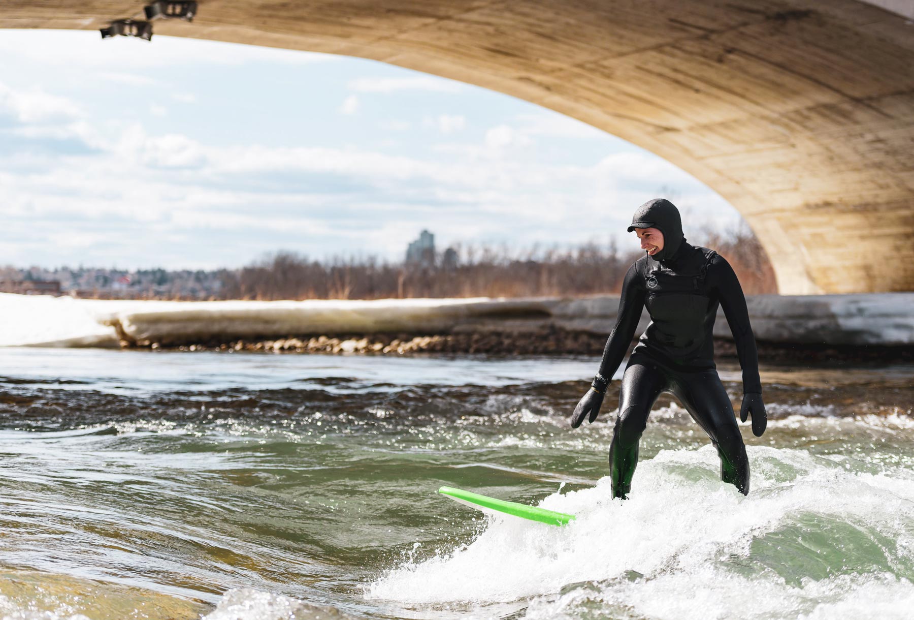 Andrea on the Bow River wave 10 Street Bridge Calgary March 2019. Photo: Aidan Nidelet/The Press