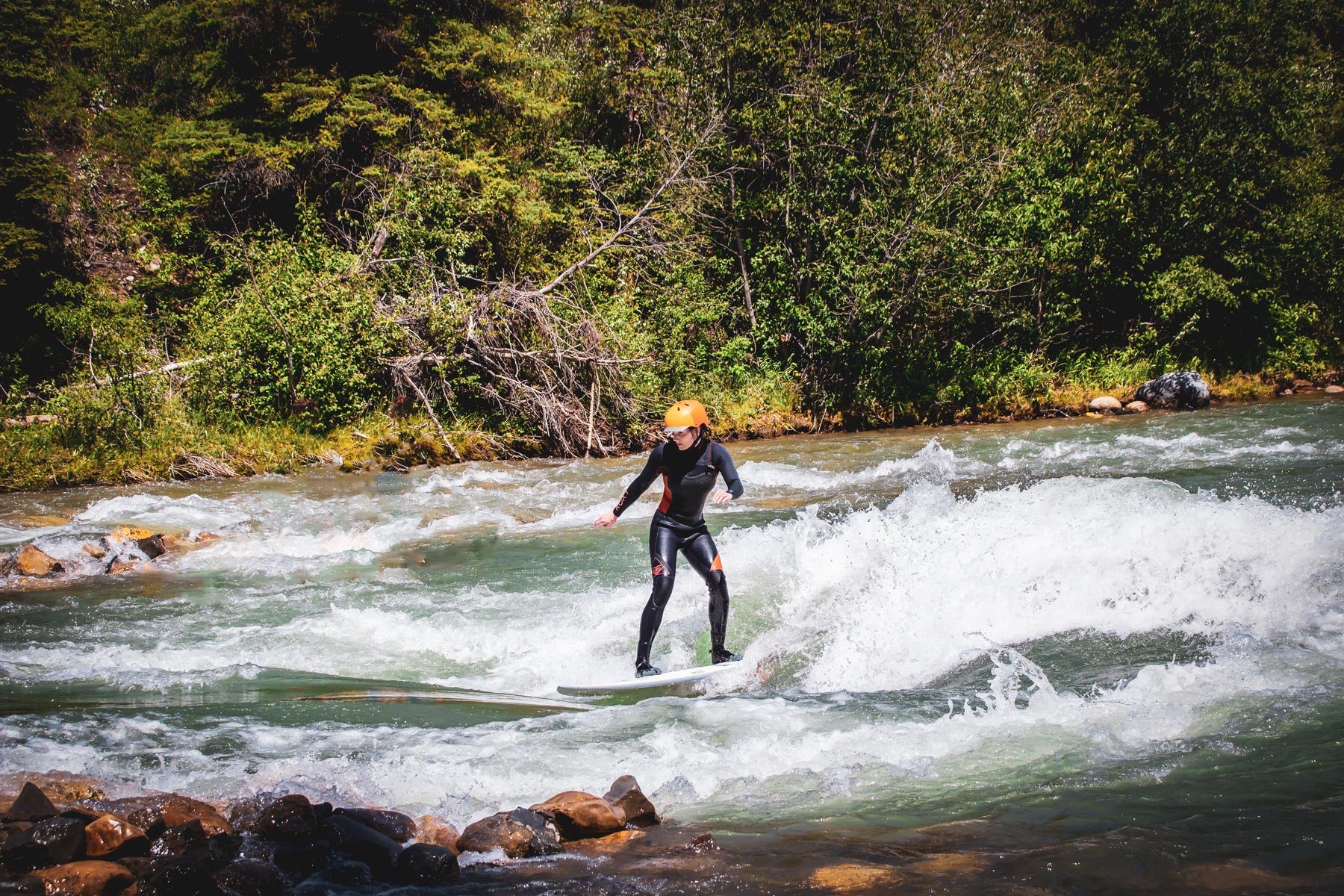 Andrea surfing the mountain wave in Kananaskis country. Photo: Christian Scagliati