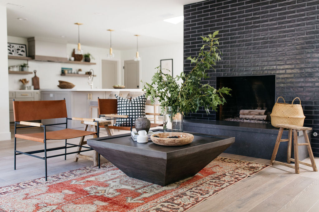 greige design shop + interiors alexandria project san diego california beach house black stacked tile fireplace living room design