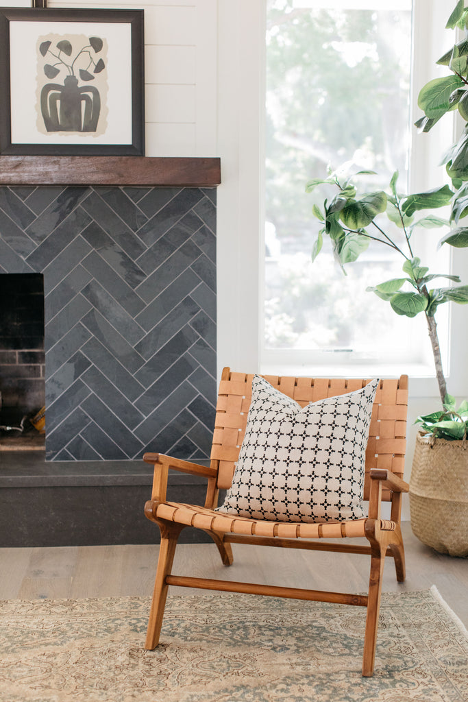 greige design shop + interiors albion project san diego california black herringbone fireplace tile greige textiles pillow
