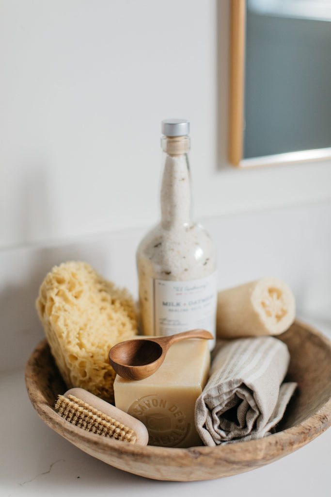 greige design shop + interiors albion project san diego california master bathroom organic wood bowl nail brush square french soap