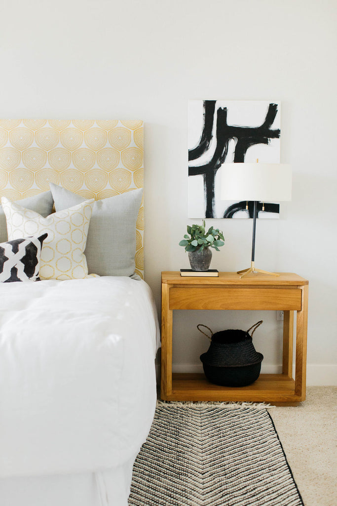 greige design shop + interiors l greige textiles ward and cape custom upholstered headboard black and white art