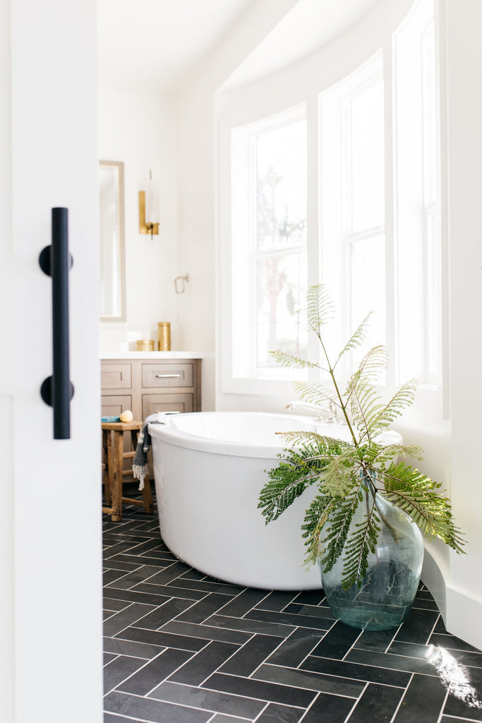 greige design shop + interiors devonshire project san diego california white barn door master bathroom