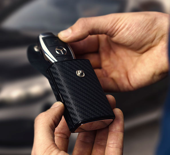 KeyBlcok open in hand with Mercedes-Benz key ejected from top