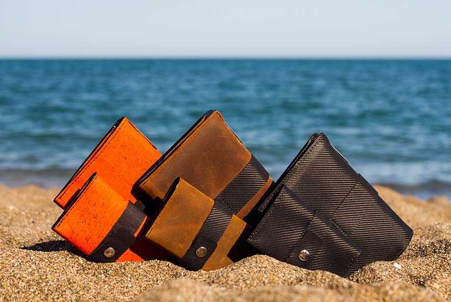 Vanacci Traveller Classic travel wallets, row of three, orange cork leather, indy leather, mach leather, with Tasca Classic wallets in foreground