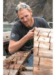 Martijn Stiphout of Ventana Surfboards inspecting Doug fir hull wood from the Western Flyer