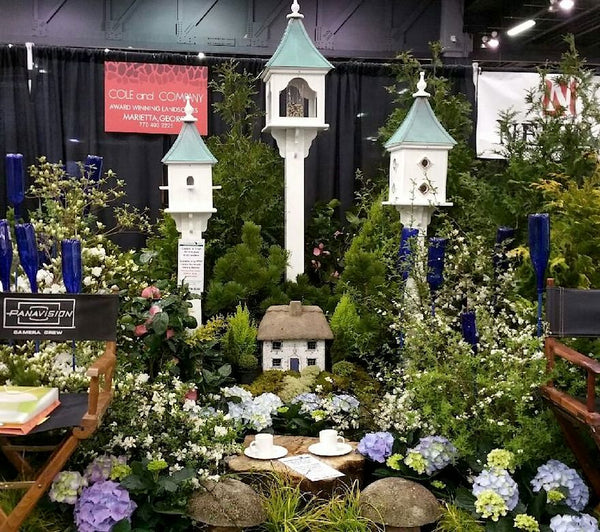 Copper Roof Bird Feeder and Houses grace the landscape booth