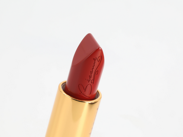 red velvet lipstick closeup on white background