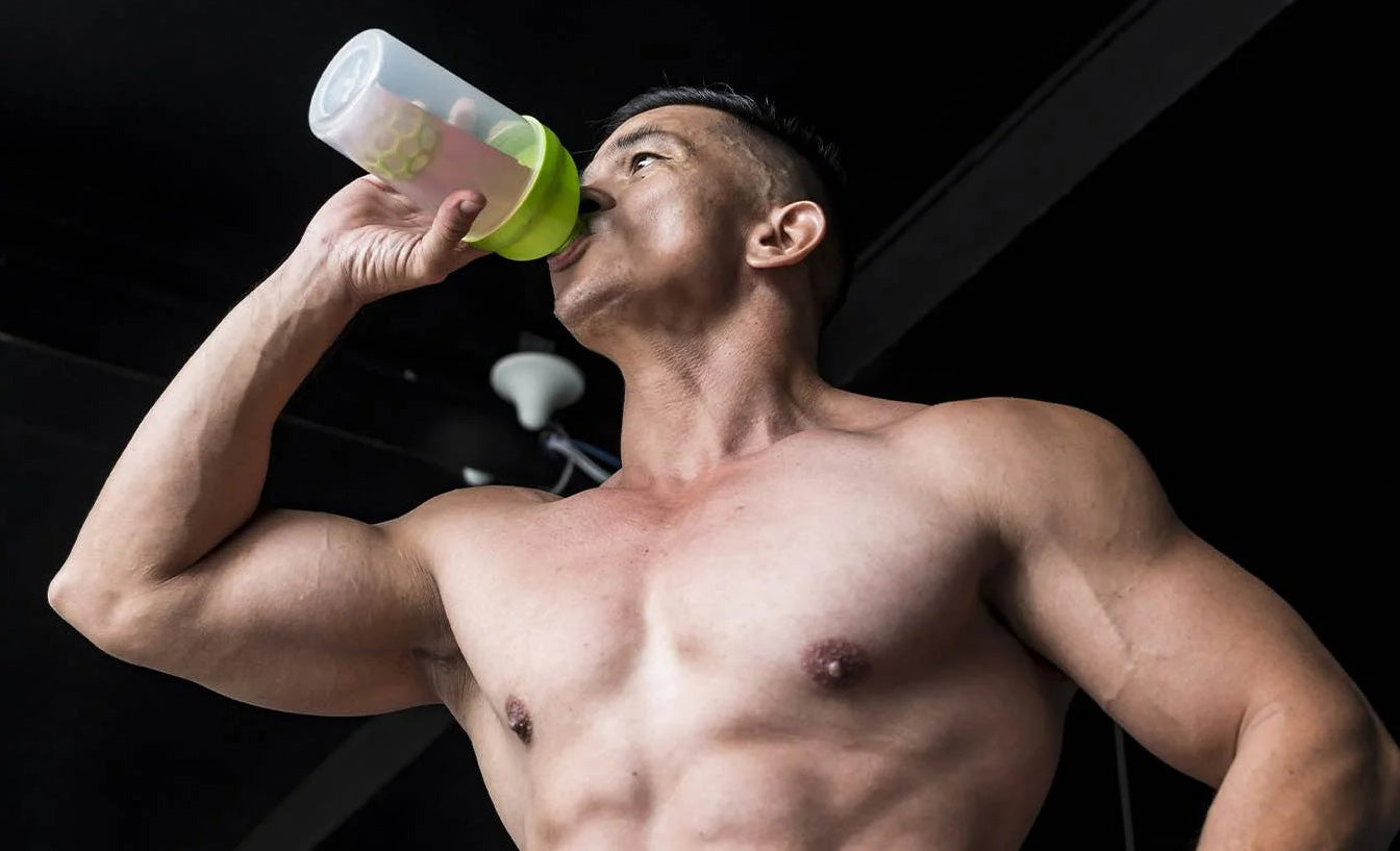 fit guy drinking after working out