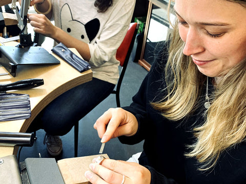 Student filing her sterling silver ring | Silver Ring Making Workshop | Pod Jewellery