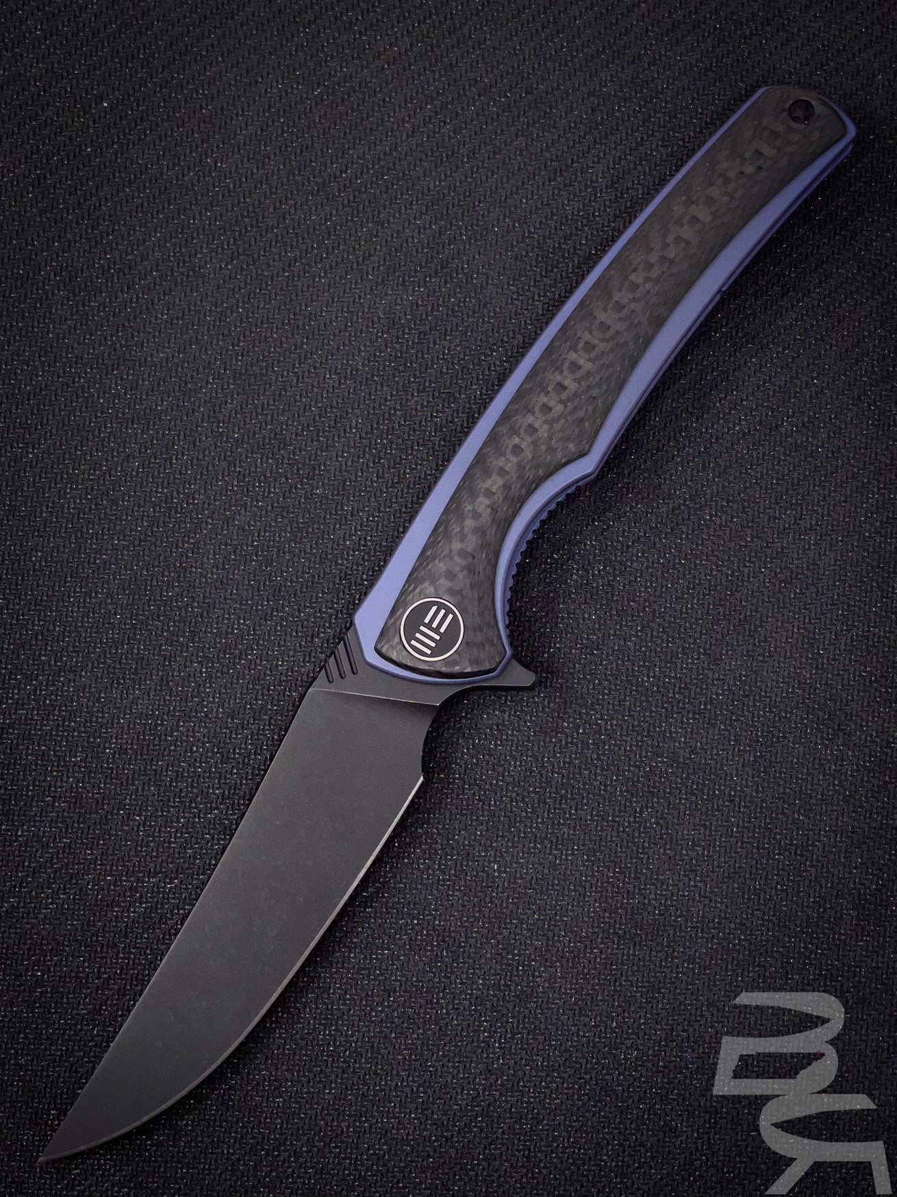 We Knife Company 704CF-G Flipper 3.625" M390 Black Stonewashed Blade, Carbon Fiber and Blue Titanium Handles