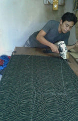 Our tailor cutting the material with utmost care