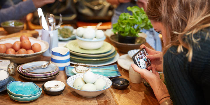 A blogger photographing eggs at a publicity event hosted in our kitchen venue.